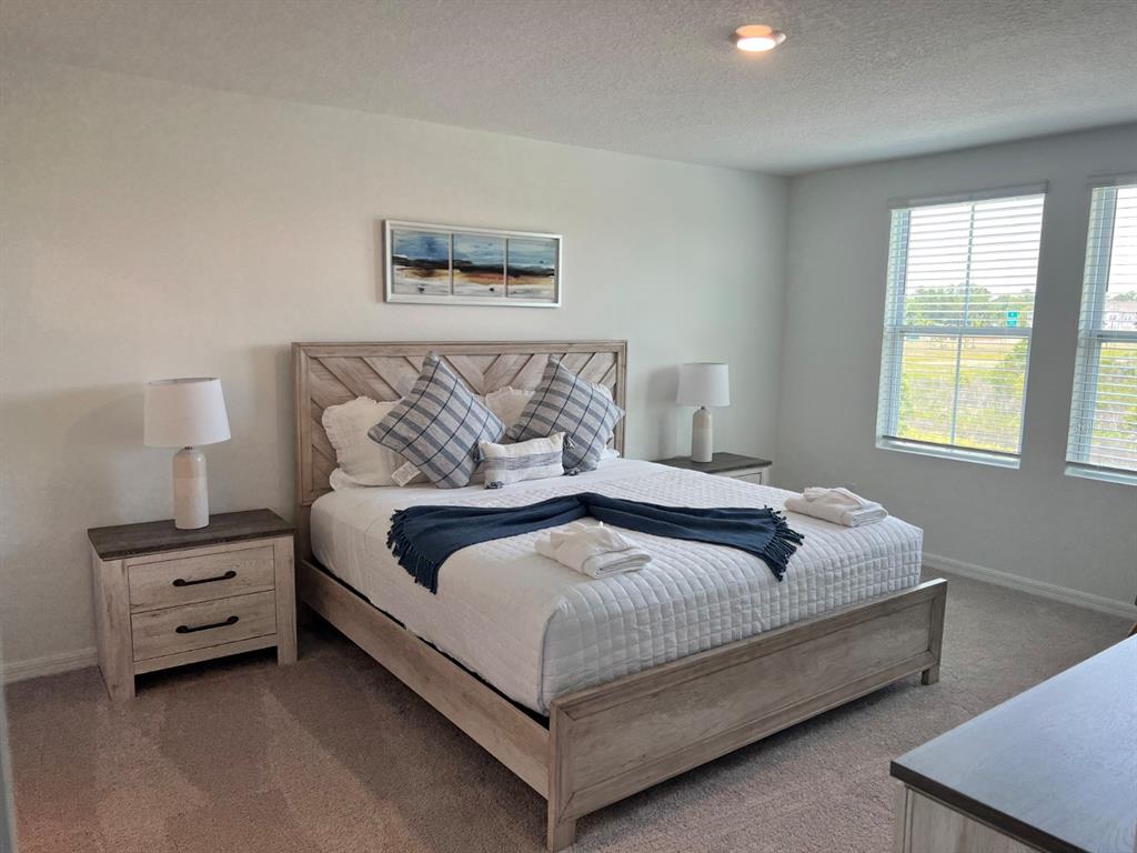 955 Conch Road Davenport, FL 33896 - Photo 7 of 20 a bedroom with bed and window