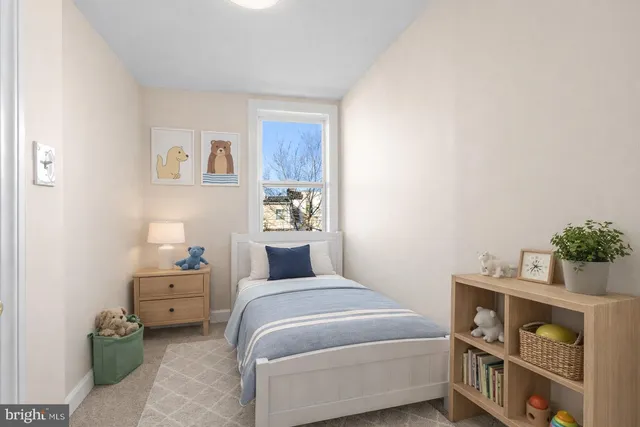 a bedroom with a bed and a bookshelf