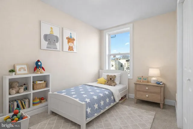 a bedroom with a bed and a book shelf