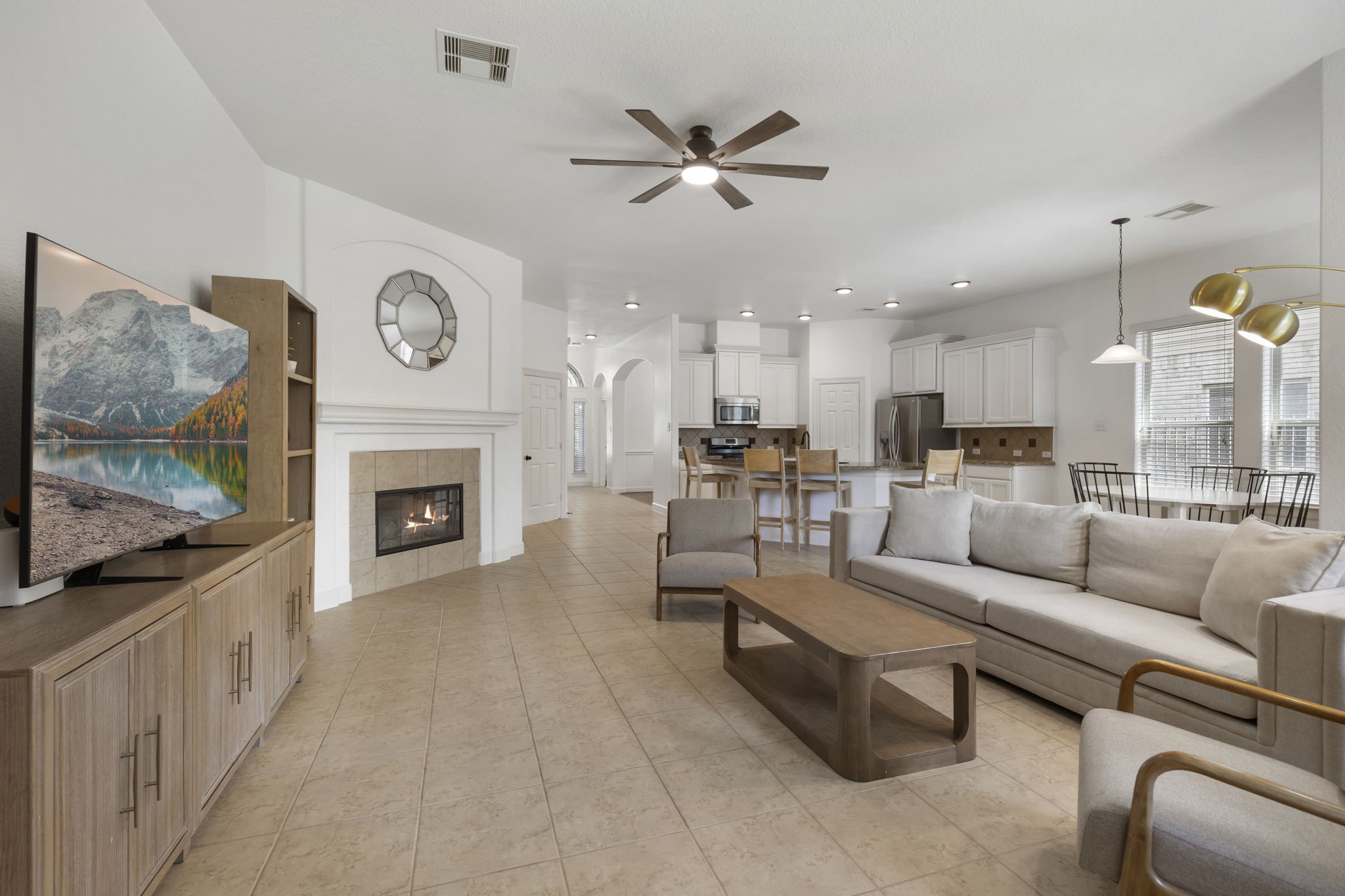 71 Sagamore Ridge Place The Woodlands, TX 77389 - Photo 19 of 34 a living room with furniture and a fireplace