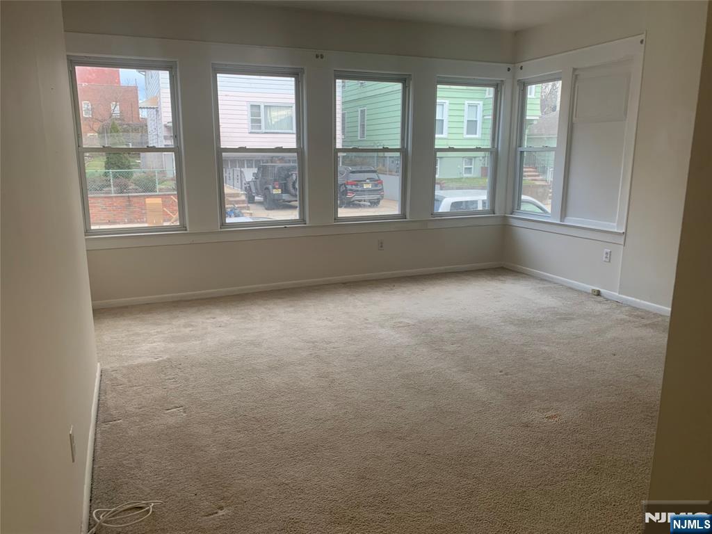 10 Exchange Place, Unit 1 Clifton, NJ 07011 - Photo 18 of 19 a view of an empty room with a window