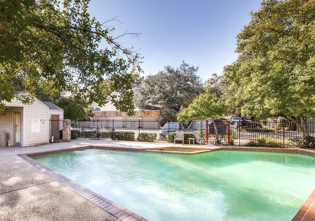 7340 Skillman Street, Unit 1203 Dallas, TX 75231 - Photo 11 of 12 a view of a house with swimming pool and sitting area