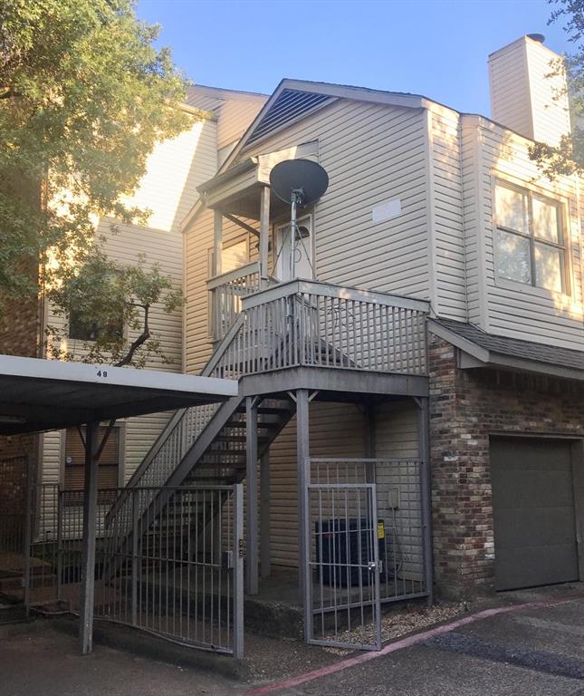 7340 Skillman Street, Unit 1203 Dallas, TX 75231 - Photo 10 of 12 a front view of a house with a balcony