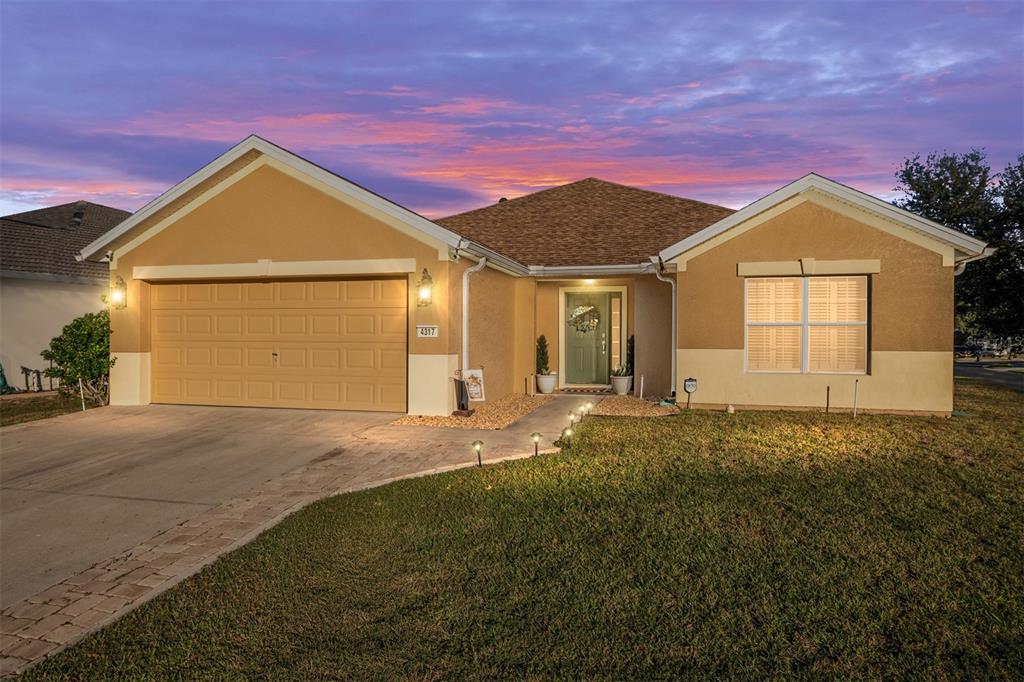 4317 Southwest 57th Avenue Ocala, FL 34474 - Photo 2 of 73 a view of a house with a yard