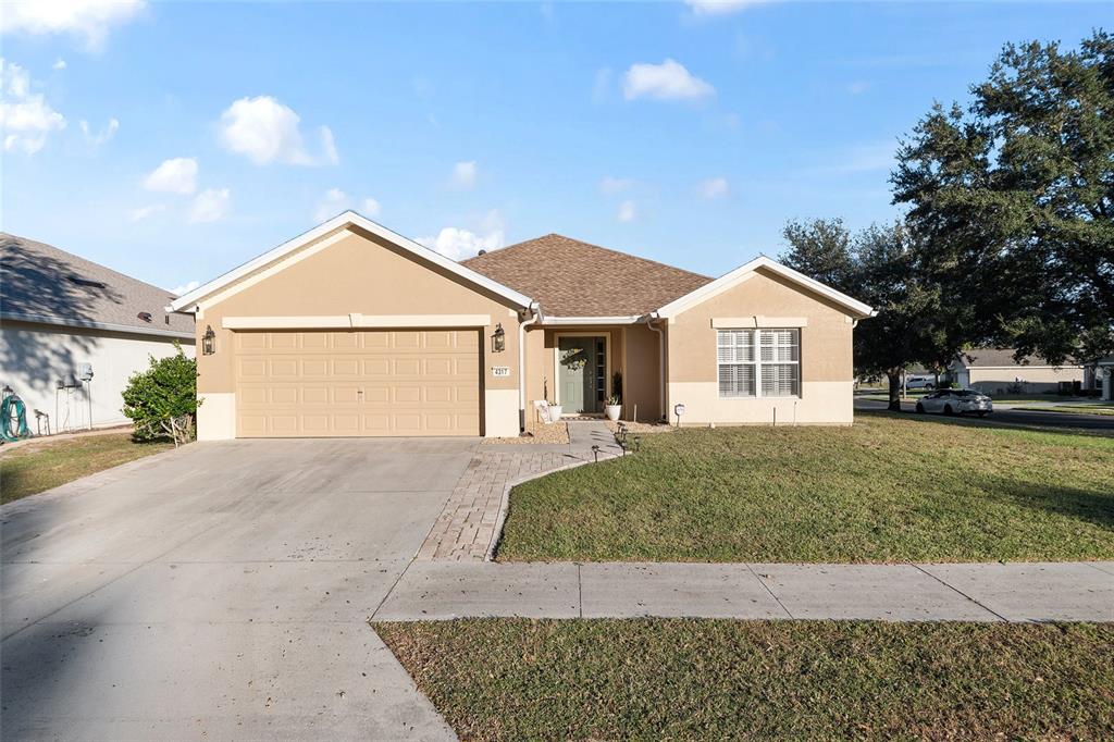 4317 Southwest 57th Avenue Ocala, FL 34474 - Photo 9 of 73 a view of a house with a yard