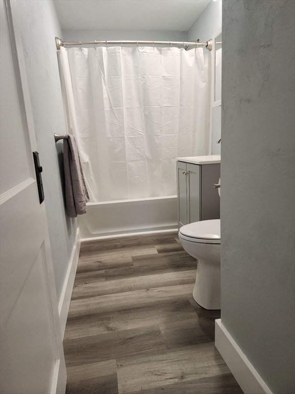 63 Fifth Avenue, Unit 1 Worcester, MA 01607 - Photo 7 of 13 a bathroom with a sink and a toilet