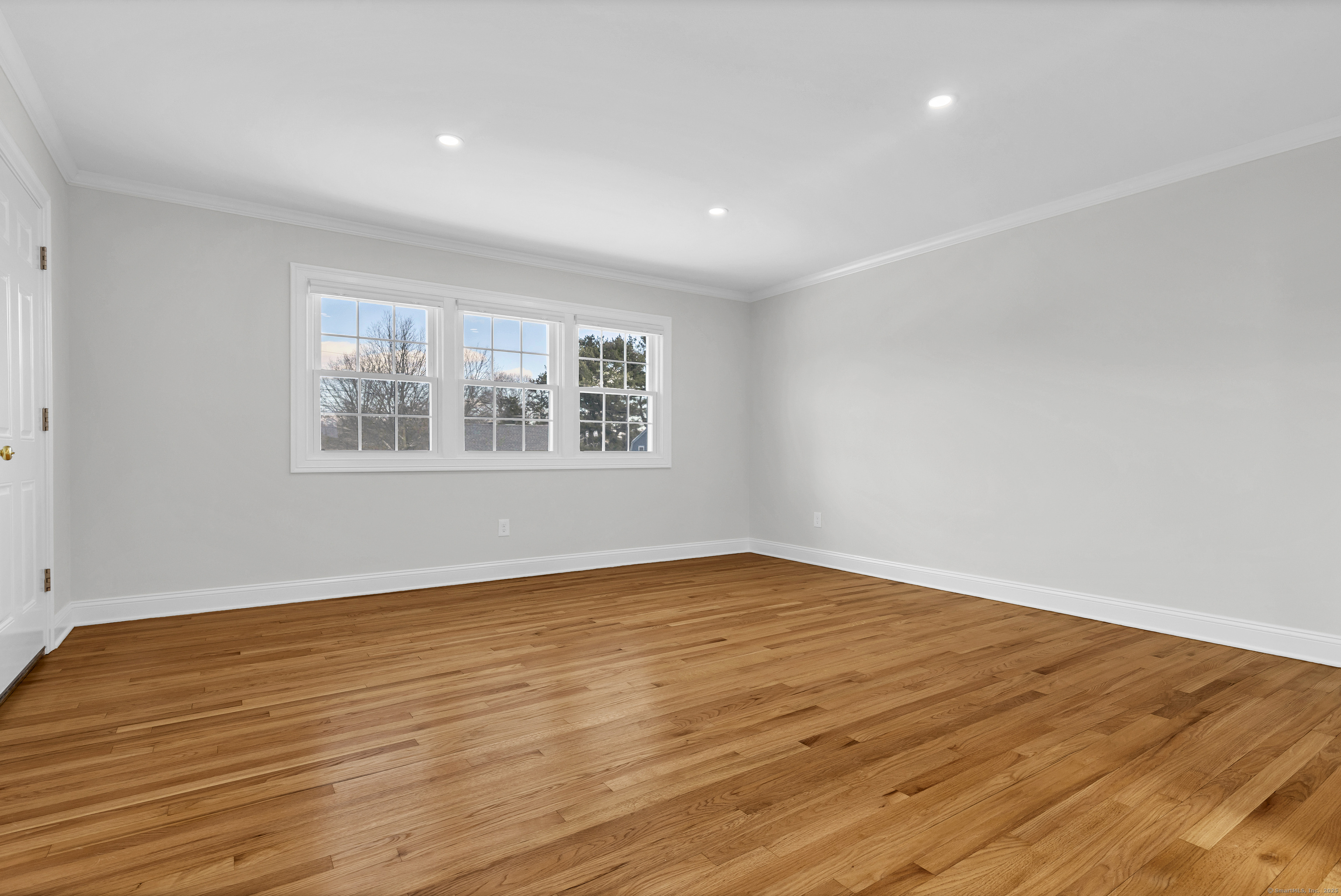 122 North Street, Unit 4 Guilford, CT 06437 - Photo 11 of 22 a view of empty room with wooden floor and fan