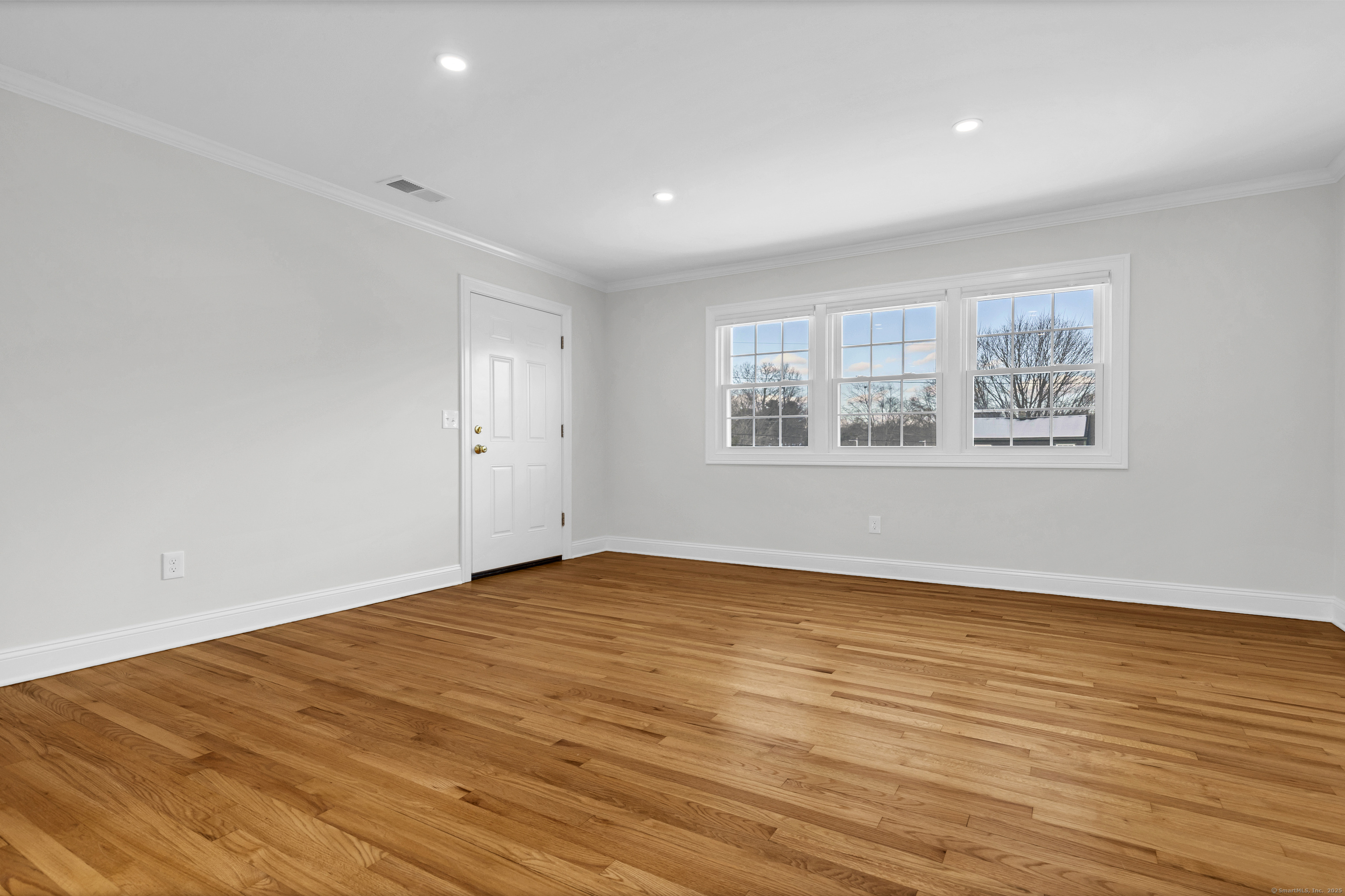 122 North Street, Unit 4 Guilford, CT 06437 - Photo 12 of 22 a view of empty room with wooden floor and fan