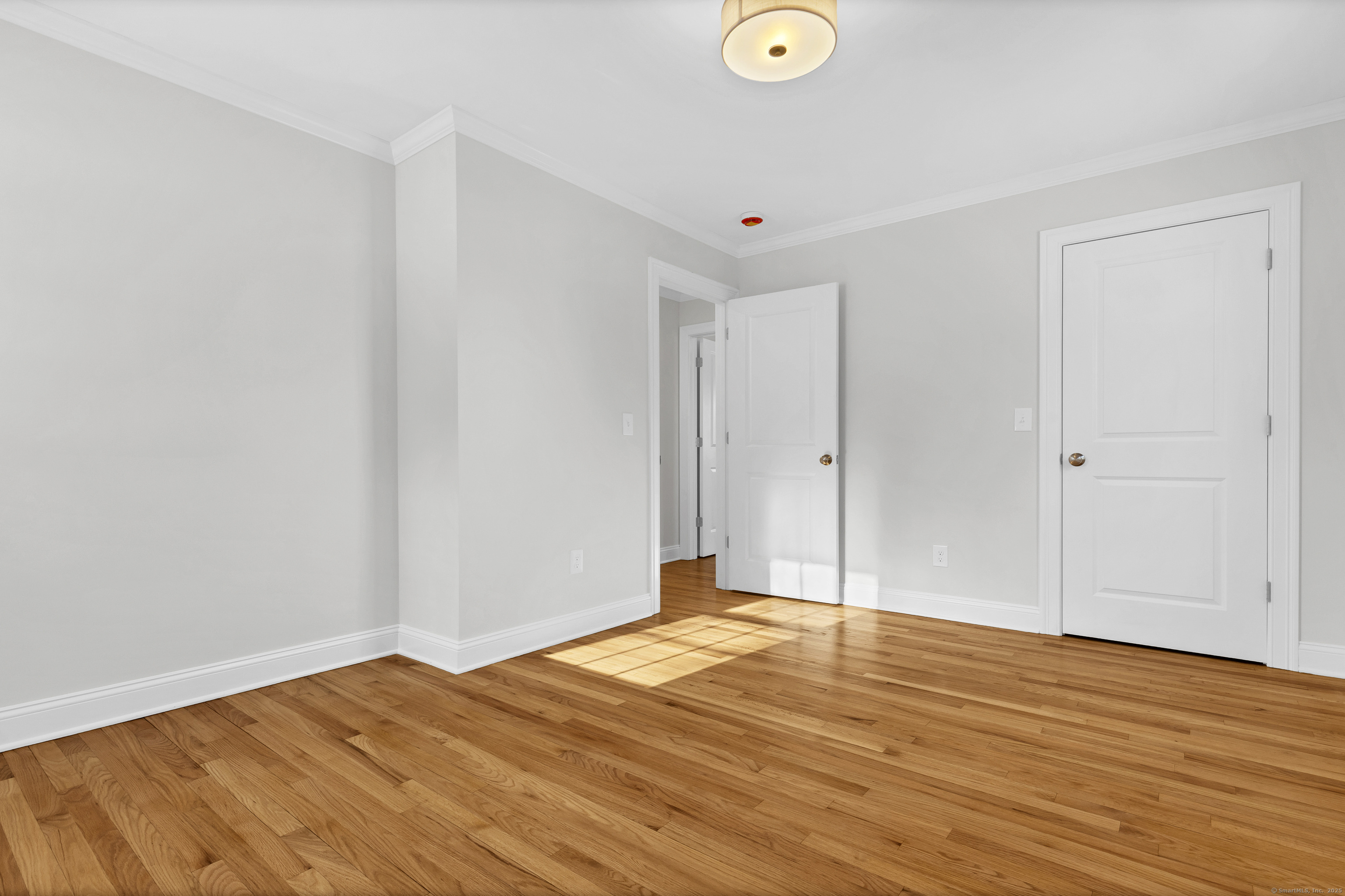 122 North Street, Unit 4 Guilford, CT 06437 - Photo 20 of 22 a view of empty room with wooden floor