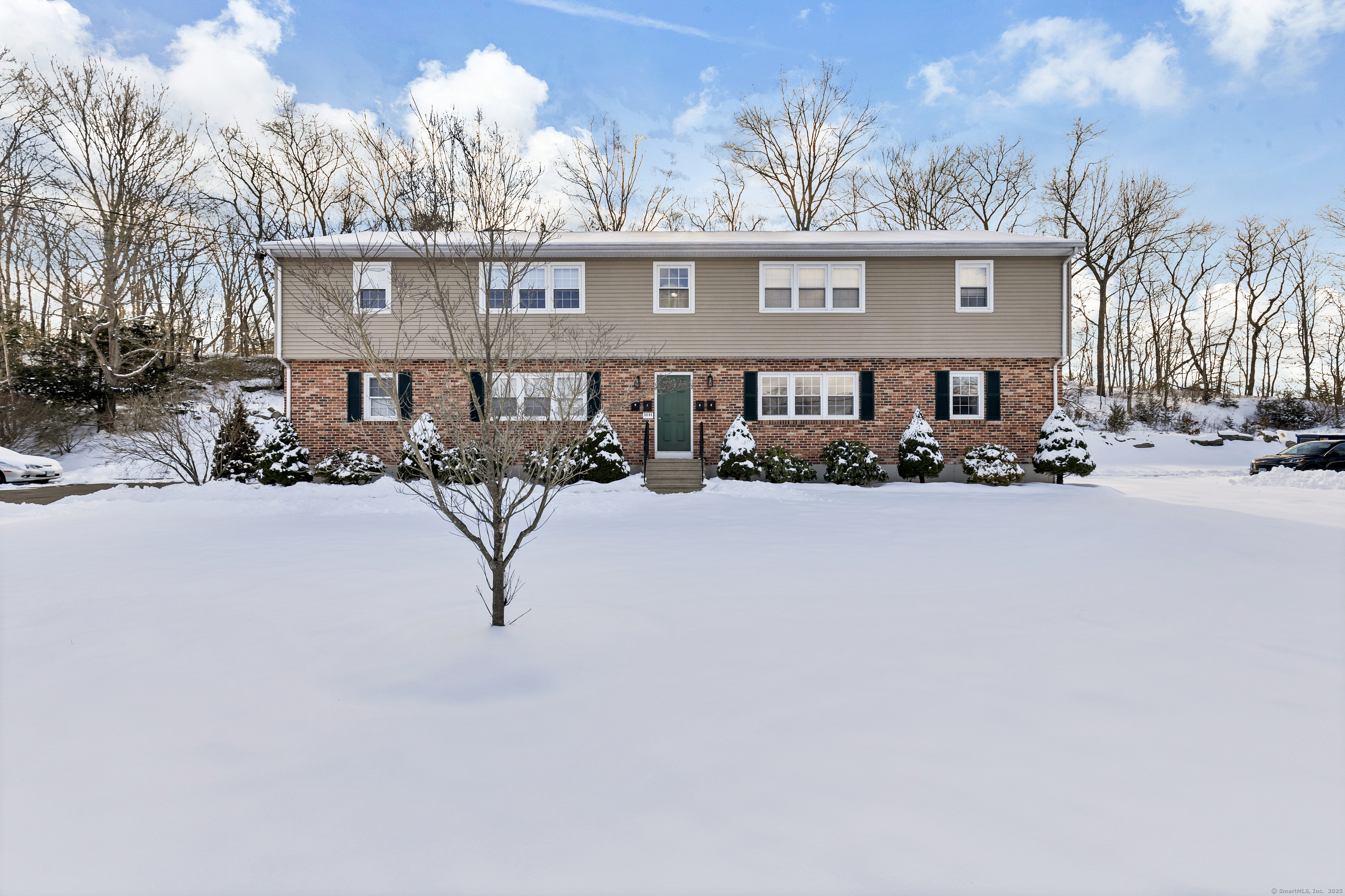 122 North Street, Unit 4 Guilford, CT 06437 - Photo 2 of 22 a front view of a building with cars parked