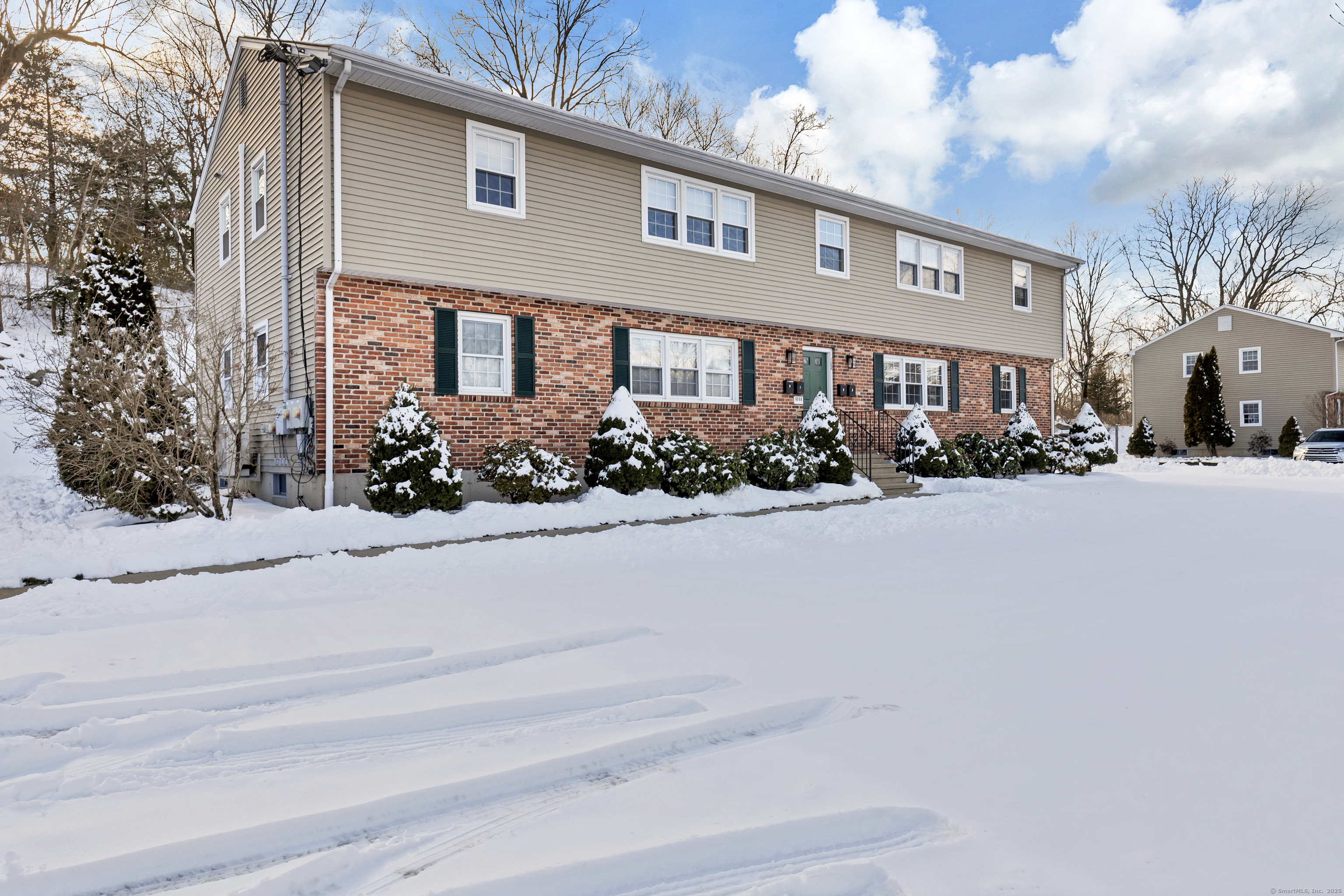 122 North Street, Unit 4 Guilford, CT 06437 - Photo 3 of 22 a front view of a house with a yard and outdoor seating