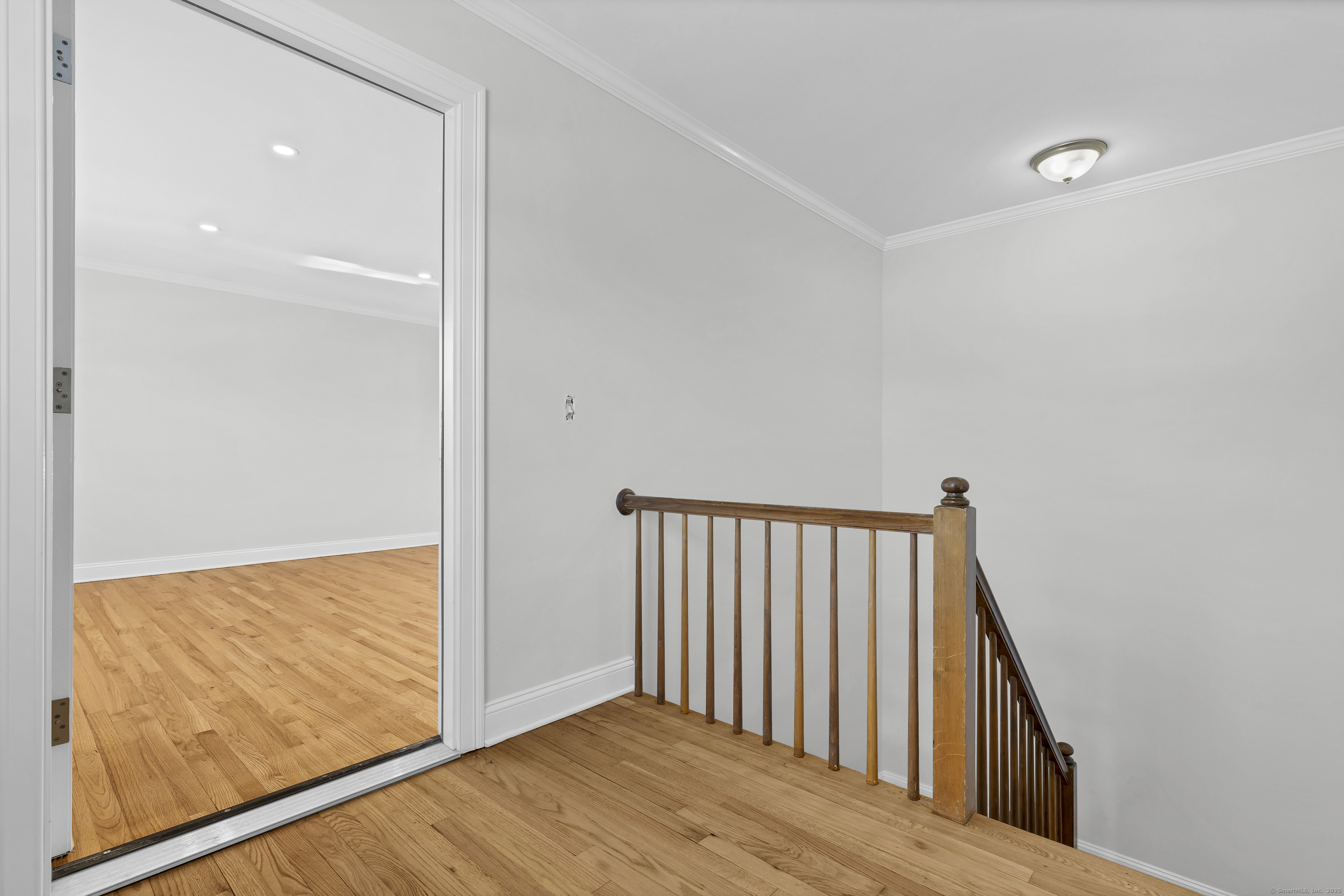 122 North Street, Unit 4 Guilford, CT 06437 - Photo 4 of 22 a view of hallway with wooden floor