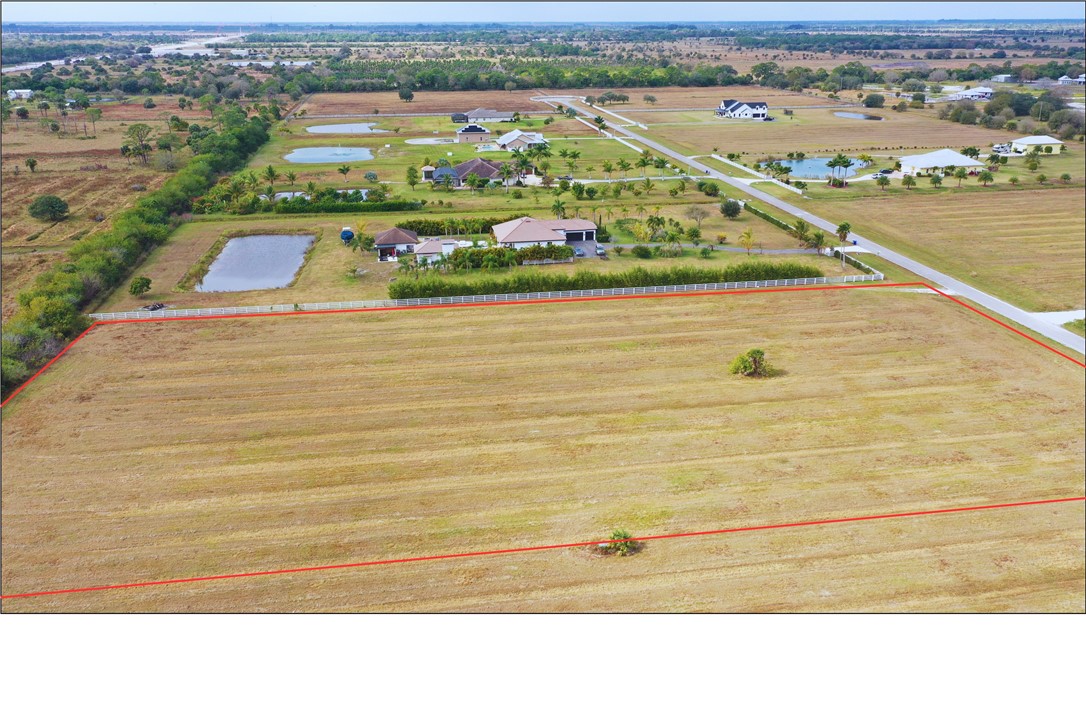 7225 6th Street Southwest Vero Beach, FL 32968 - Photo 2 of 4 a black and white photo of a lake