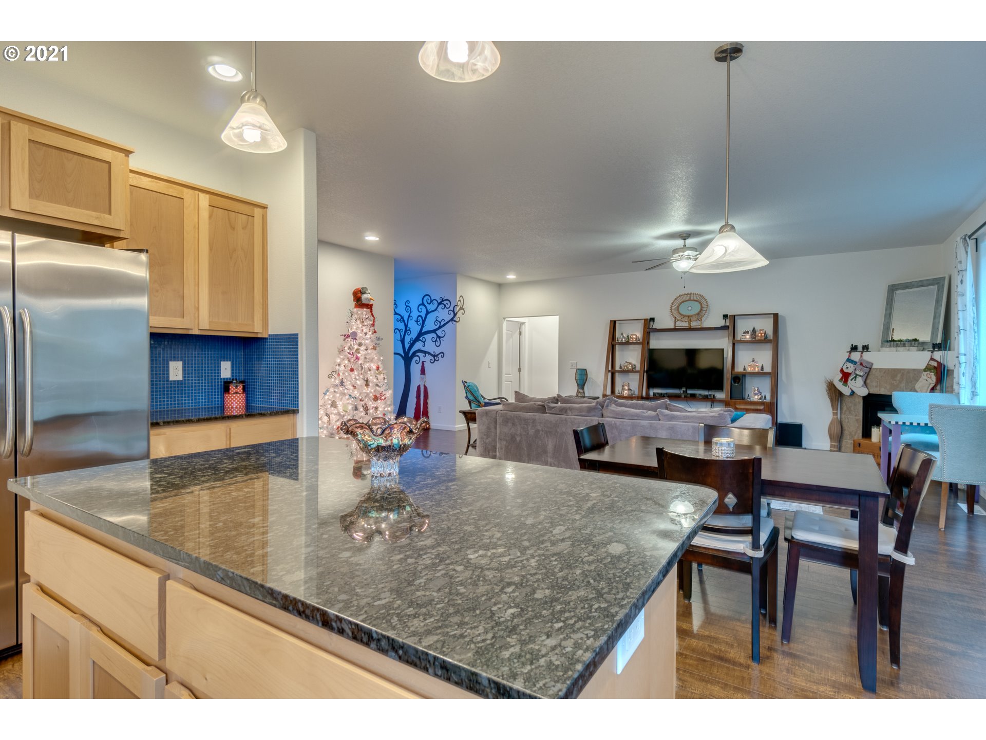 2609 South 18th Court Ridgefield, WA 98642 - Photo 11 of 26 a kitchen with kitchen island a sink stove and refrigerator