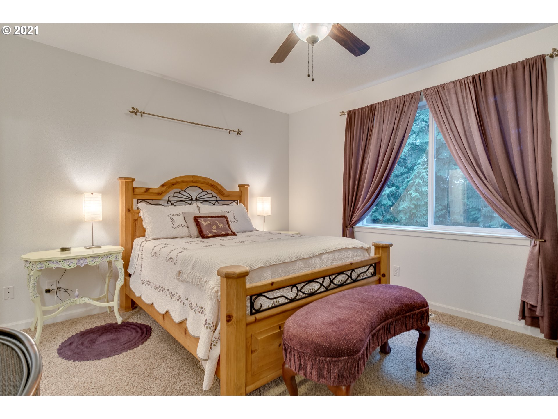 2609 South 18th Court Ridgefield, WA 98642 - Photo 17 of 26 a bedroom with a bed a window and potted plant