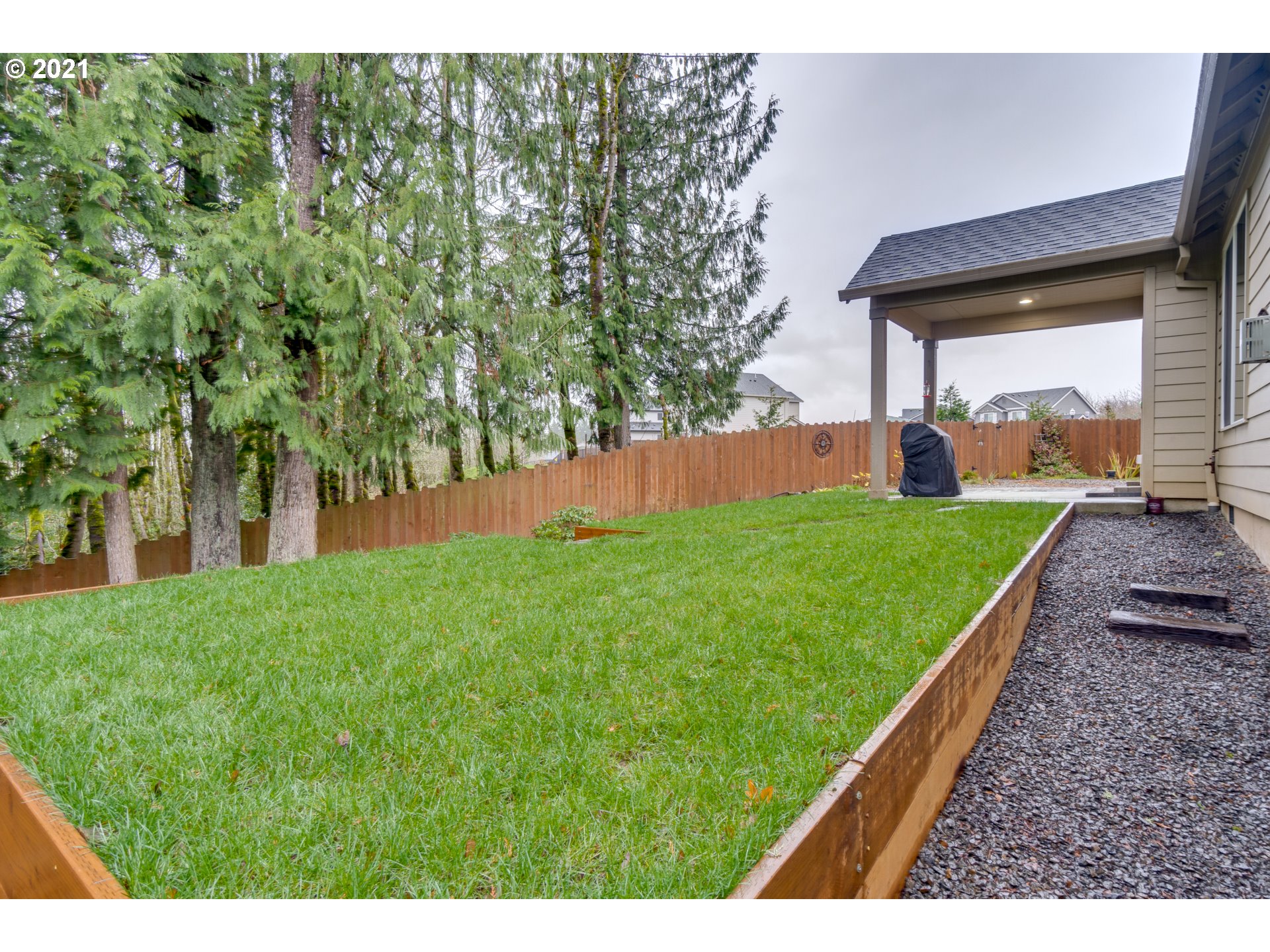 2609 South 18th Court Ridgefield, WA 98642 - Photo 23 of 26 a view of a backyard with a garden