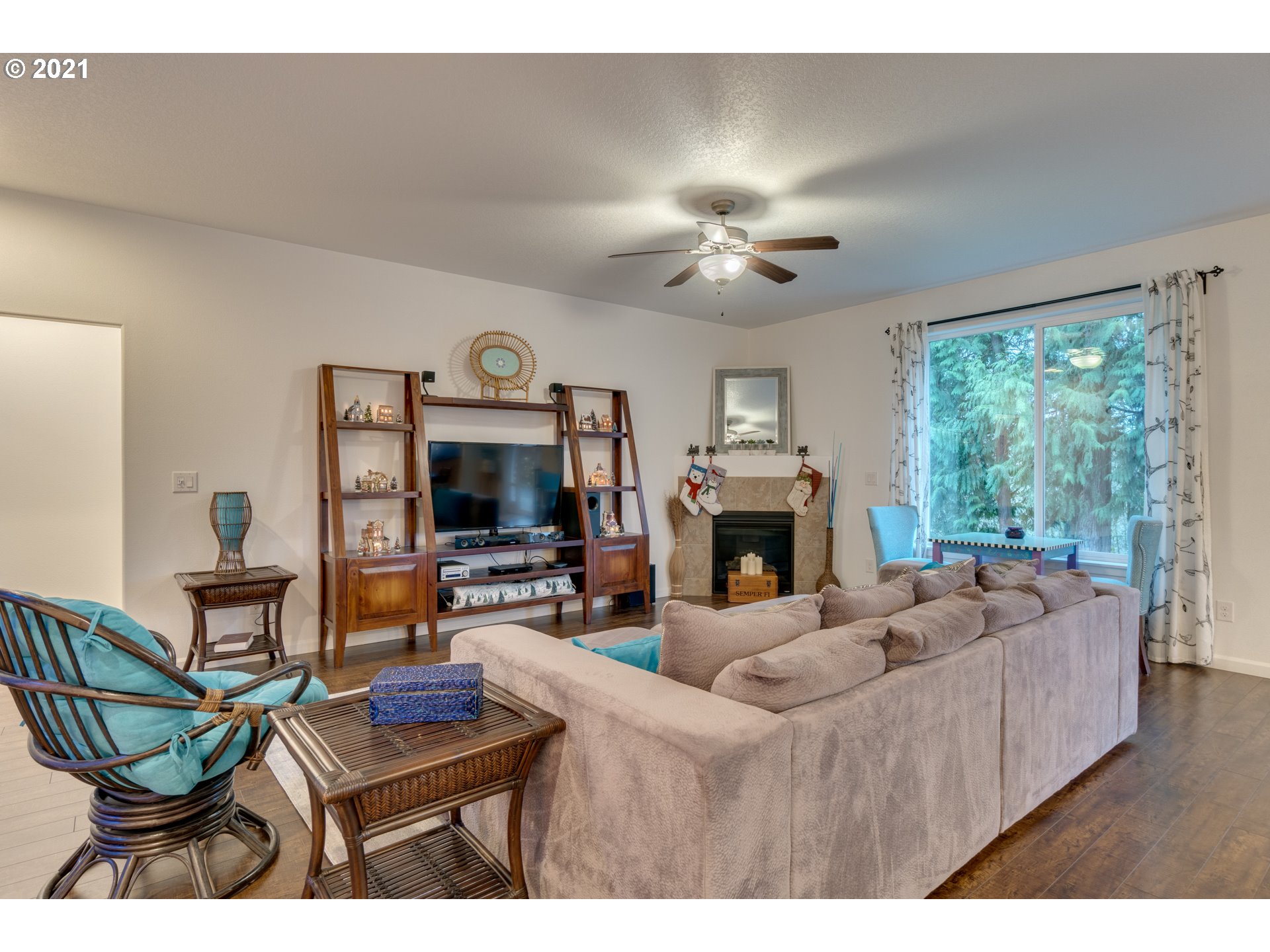 2609 South 18th Court Ridgefield, WA 98642 - Photo 6 of 26 a living room with furniture a fireplace and a large window