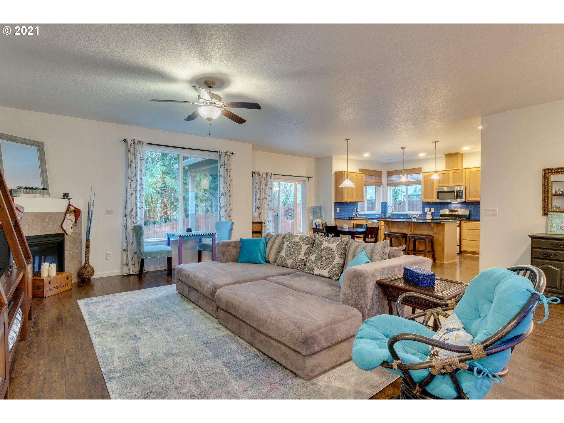 2609 South 18th Court Ridgefield, WA 98642 - Photo 7 of 26 a living room with furniture and a chandelier
