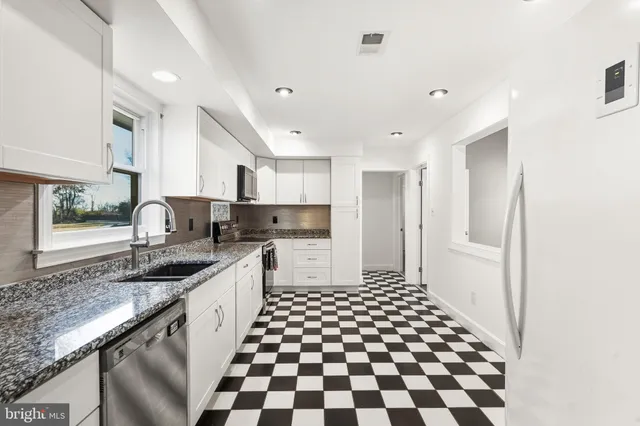 a view of yard with swimming pool