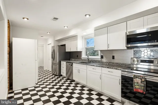 a view of a yard with a snow on the road