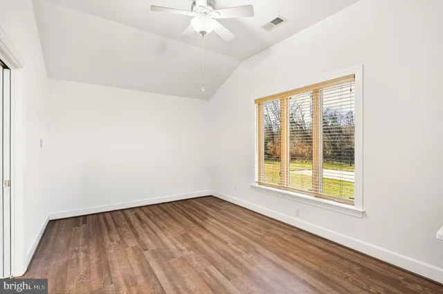 an aerial view of residential house and sandy dunes