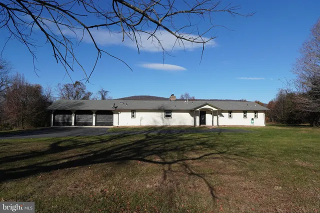 an aerial view of residential house with outdoor space