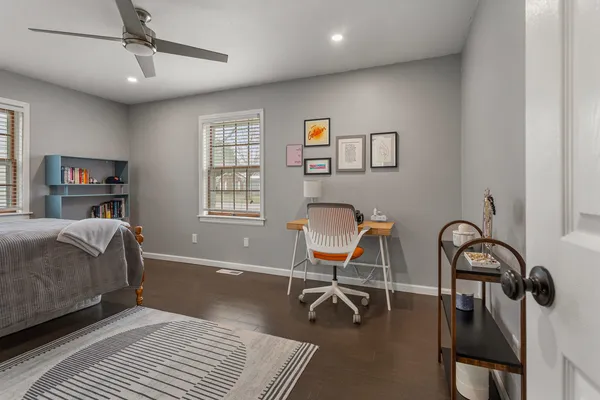 a bedroom with furniture and a window