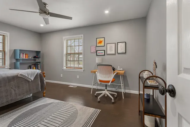 a bedroom with furniture and a window