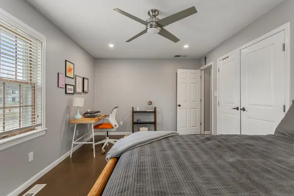 a bed room with a bed and a window