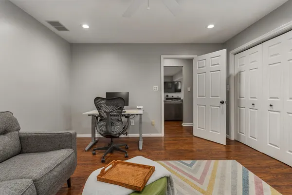 a workspace with furniture and wooden floor
