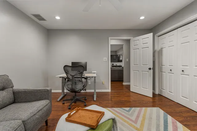 a workspace with furniture and wooden floor