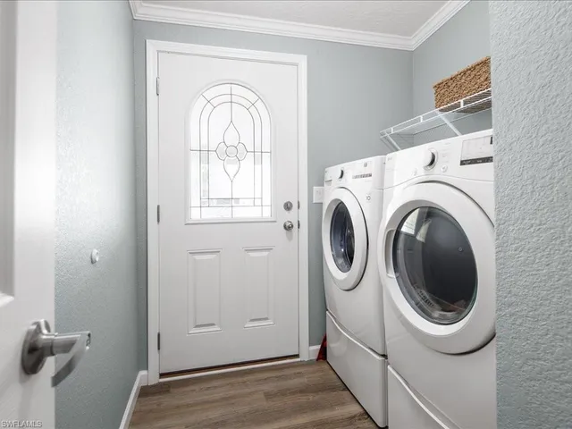a utility room with dryer and washer