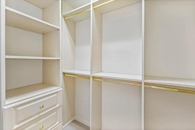 a view of an empty walk in closet