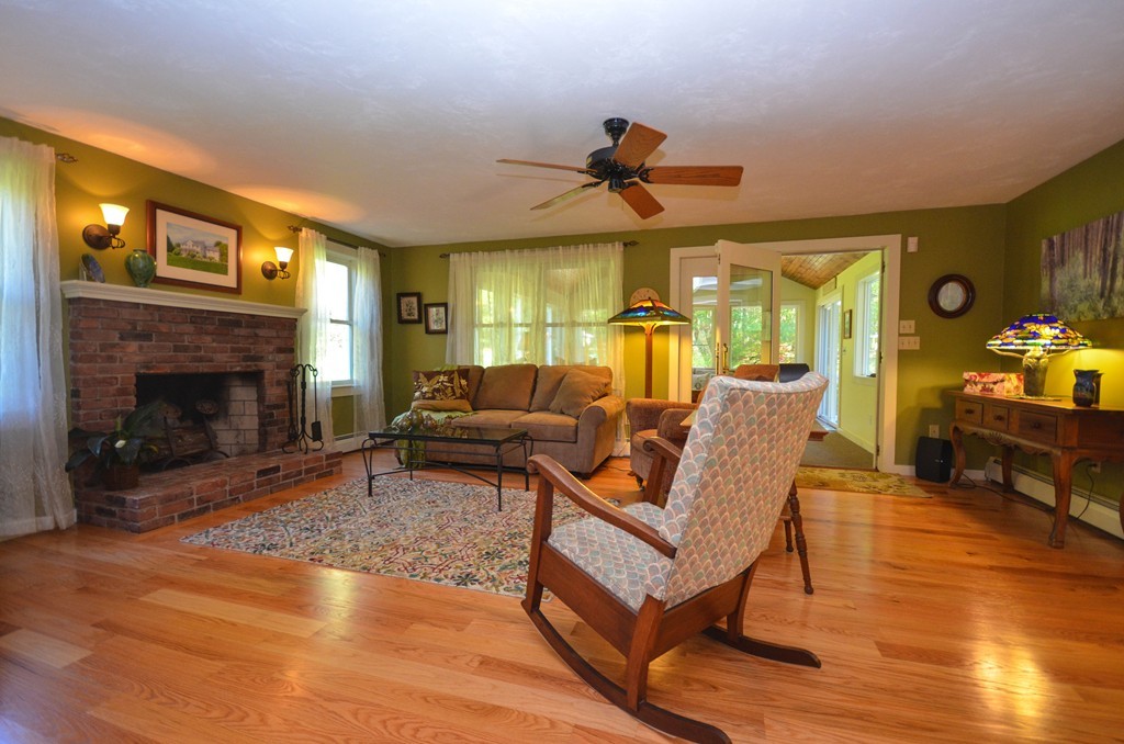 66 Barnett Road Sutton, MA 01590 - Photo 11 of 30 a living room with furniture and a fireplace