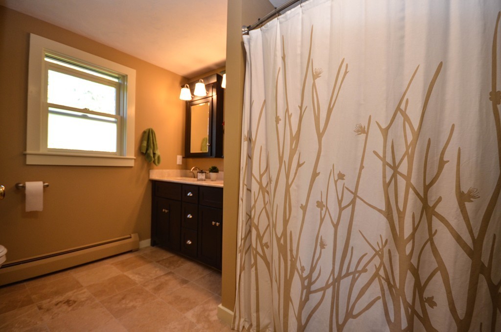 66 Barnett Road Sutton, MA 01590 - Photo 21 of 30 a bathroom with a granite countertop sink and a window