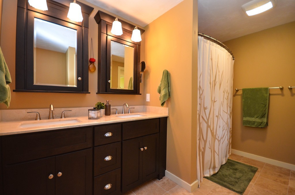 66 Barnett Road Sutton, MA 01590 - Photo 22 of 30 a bathroom with a double vanity sink and mirror