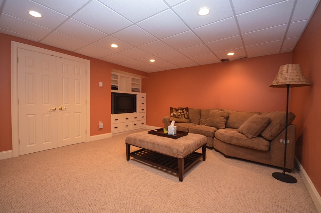 66 Barnett Road Sutton, MA 01590 - Photo 27 of 30 a living room with furniture and a flat screen tv