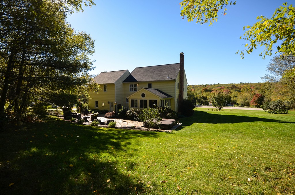 66 Barnett Road Sutton, MA 01590 - Photo 29 of 30 a view of a swimming pool with a yard