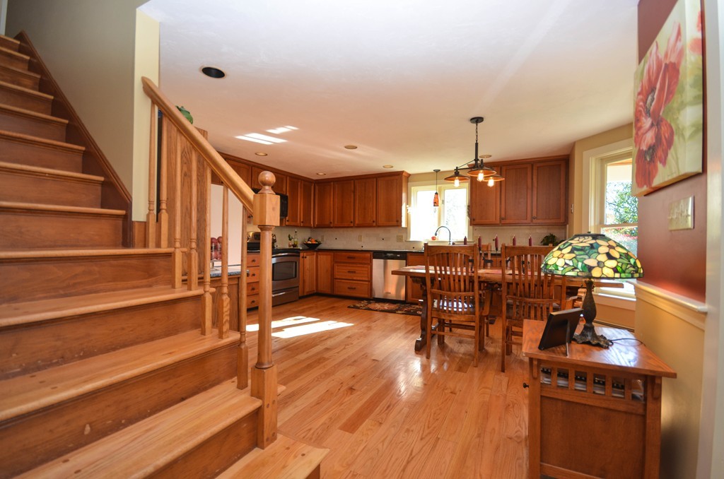 66 Barnett Road Sutton, MA 01590 - Photo 3 of 30 a view of a living room and kitchen with furniture