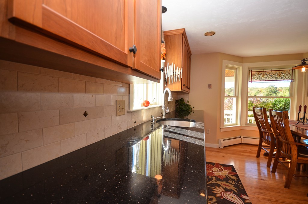 66 Barnett Road Sutton, MA 01590 - Photo 7 of 30 a kitchen with stainless steel appliances a counter top space stove sink and cabinets