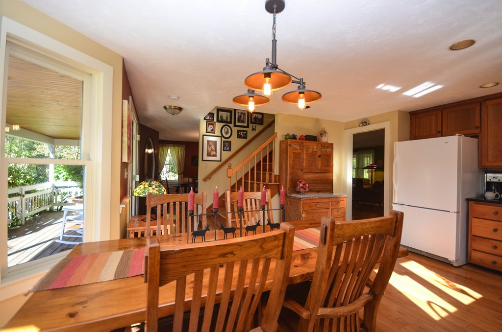 66 Barnett Road Sutton, MA 01590 - Photo 8 of 30 a view of a dining room with furniture wooden floor and a chandelier