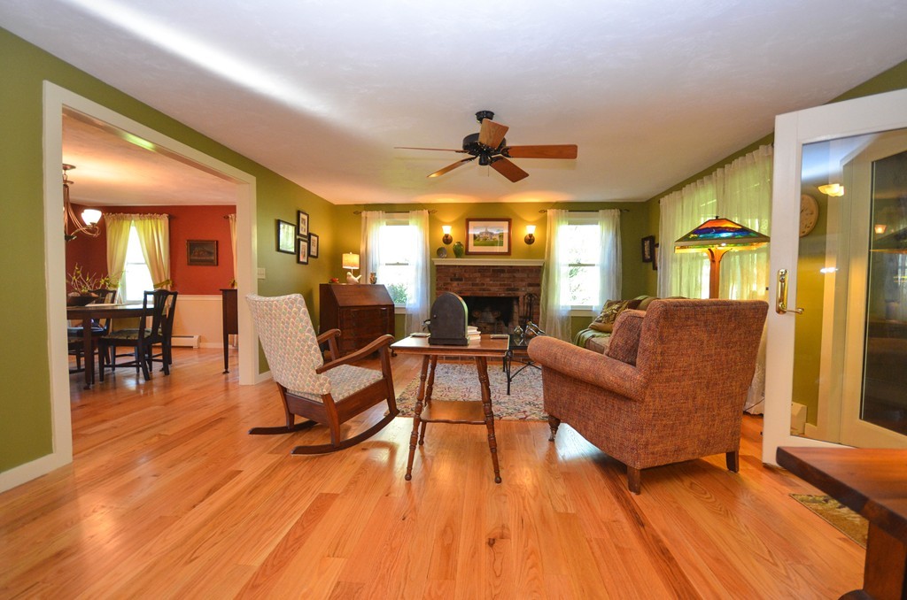 66 Barnett Road Sutton, MA 01590 - Photo 10 of 30 a living room with furniture and a fireplace