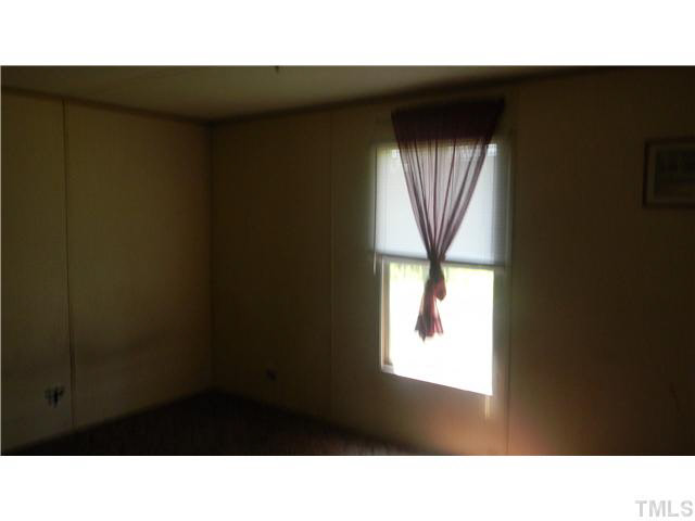 1310 Mollie Mooney Road Roxboro, NC 27574 - Photo 5 of 6 a black and white photo of a living room