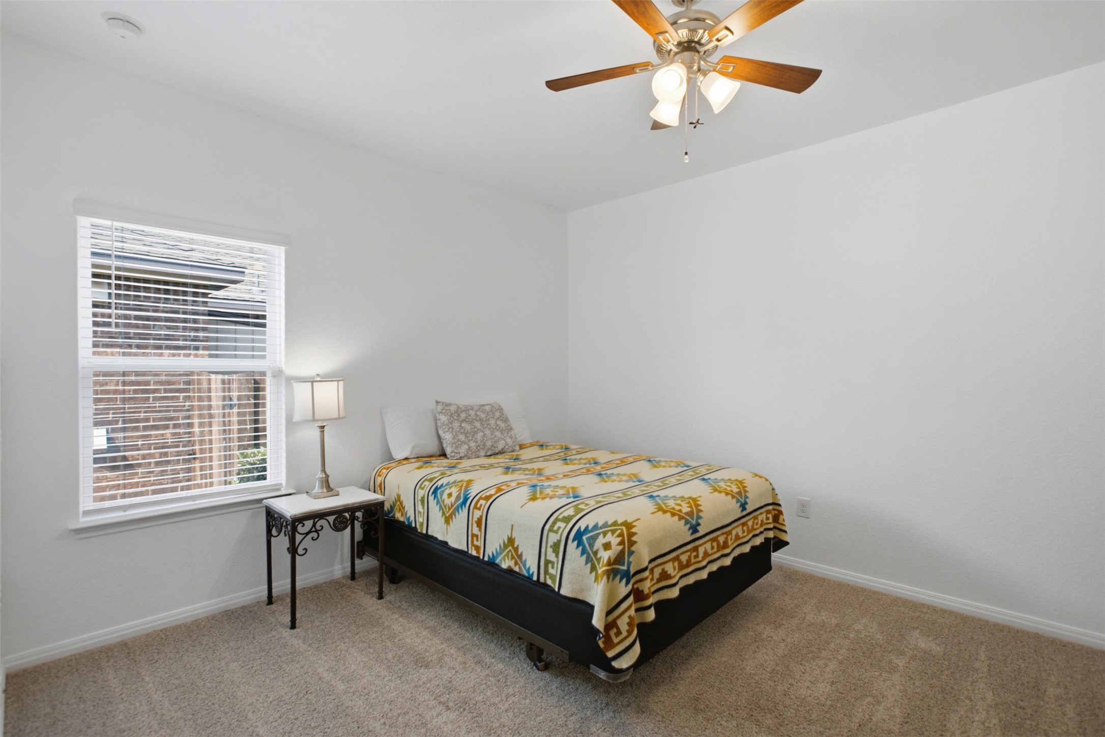 2413 Bridges Ranch Road Georgetown, TX 78628 - Photo 19 of 31 A comfortable bedroom with soft carpet flooring and natural light filtering through the window.