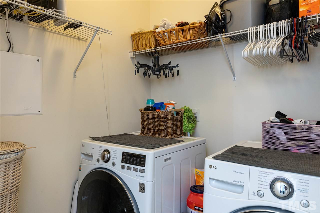 724 Edgewater Ridge Court Apex, NC 27523 - Photo 21 of 30 a utility room with dryer and washer