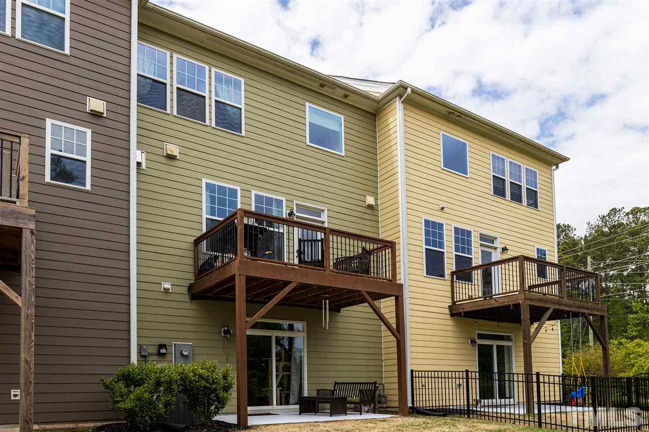 724 Edgewater Ridge Court Apex, NC 27523 - Photo 25 of 30 a view of a house with many windows