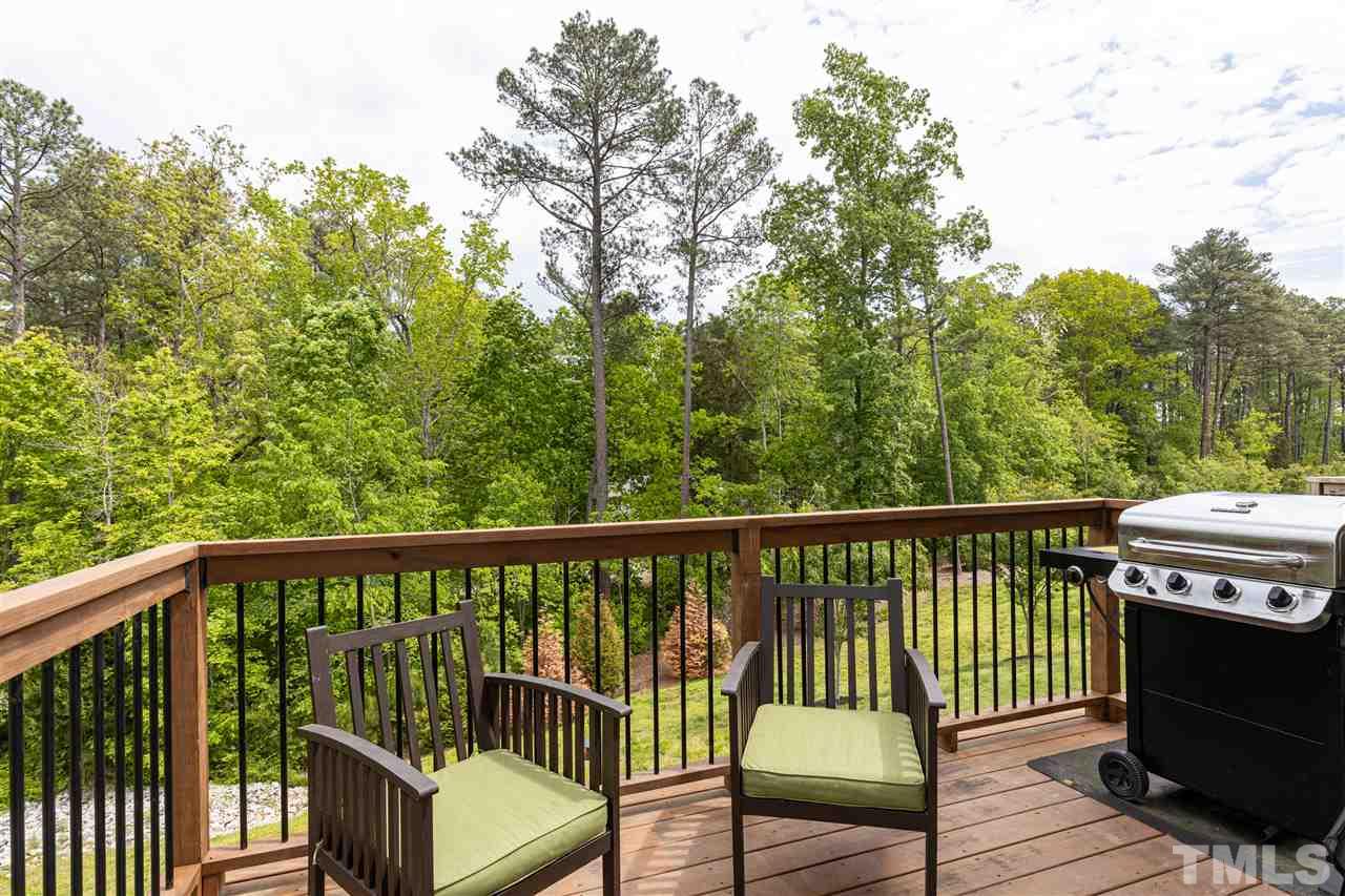 724 Edgewater Ridge Court Apex, NC 27523 - Photo 26 of 30 a view of a two chairs in the balcony