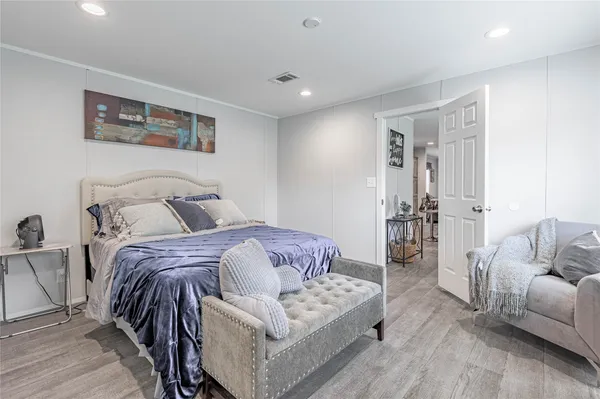 a bedroom with furniture and a couch