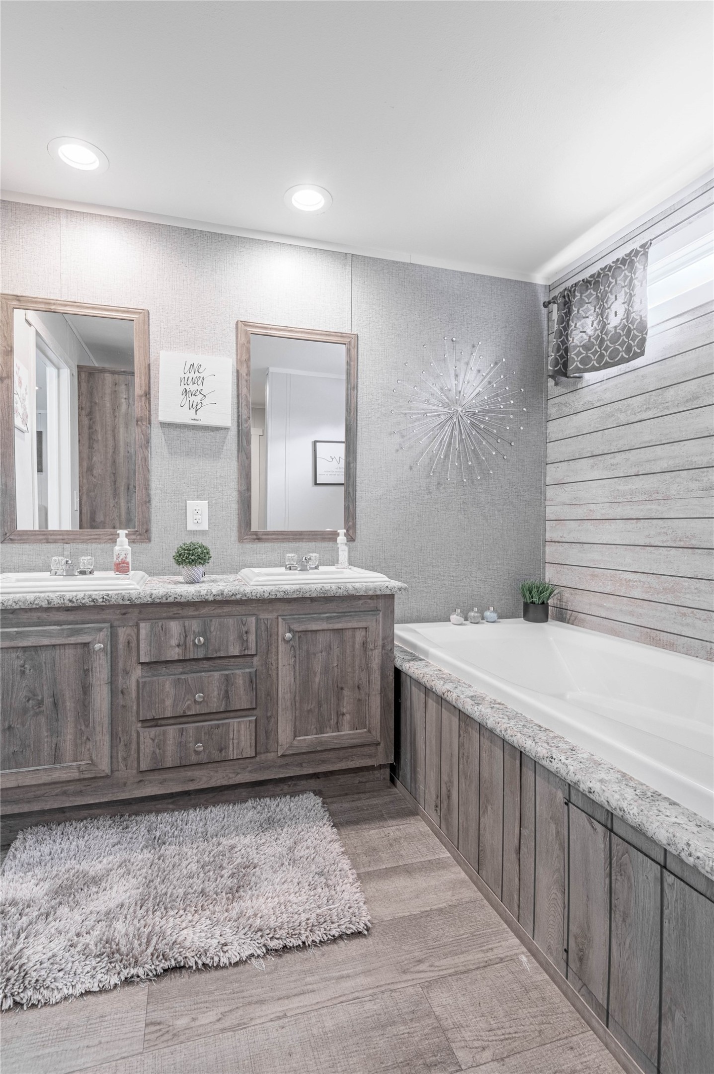 844 Harbor Point Drive Trinity, TX 75862 - Photo 17 of 32 a bathroom with a granite countertop sink and a mirror