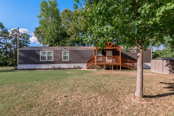 a house view with a backyard space